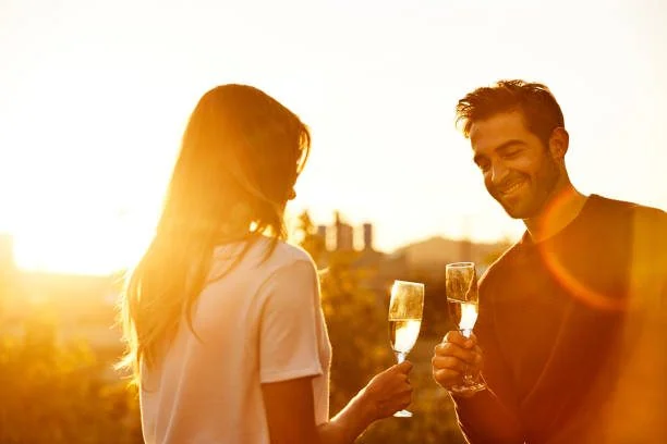 A couple at golden hour on an Adelaide rooftop